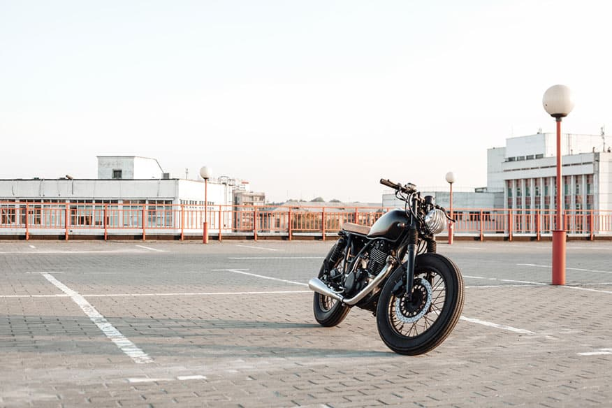 Black vintage custom motorcycle parked