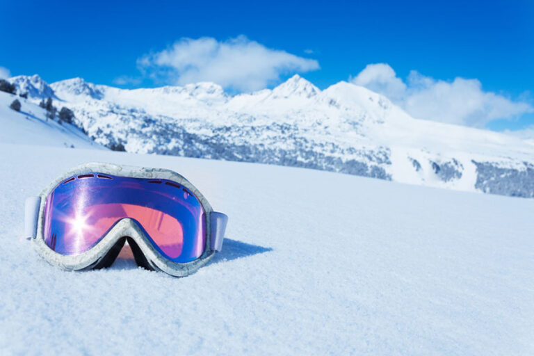 Ski and snowboard mask in the snow