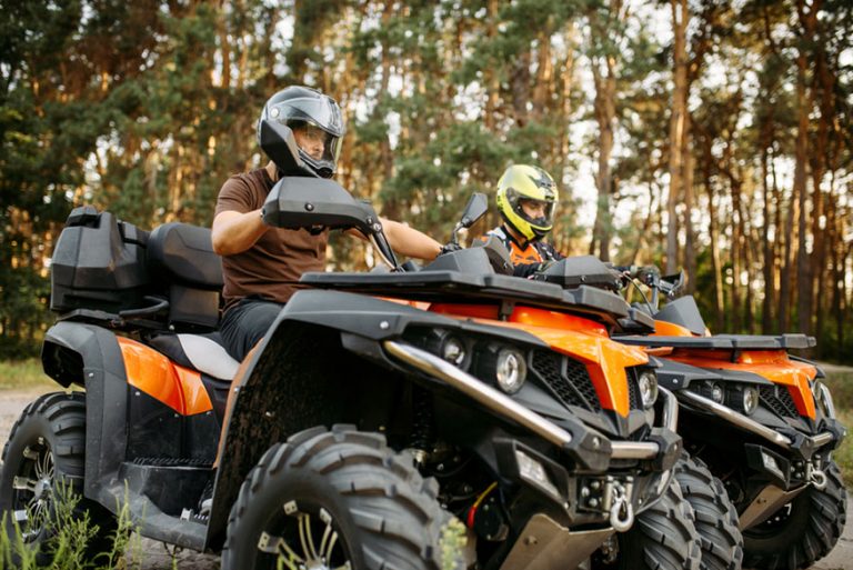 Two quad bike riders